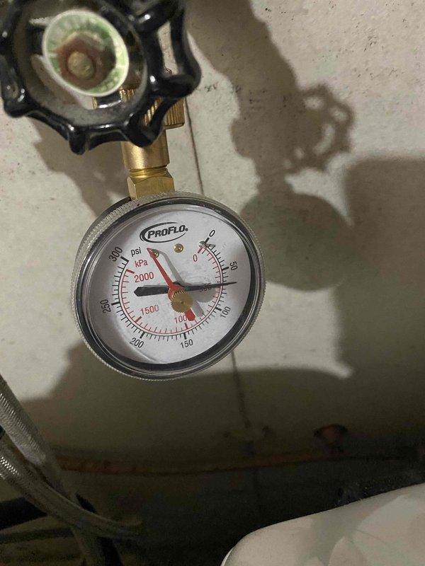 Installed new 50-gallon gas tall water heater in basement location, replacing existing unit. Properly connected copper supply lines and gas piping, verified pressure readings on PROFLO gauge were within acceptable parameters, and installed temperature-pressure relief valve assembly per code requirements. Installation completed successfully with all connections tested for leaks and proper operation.