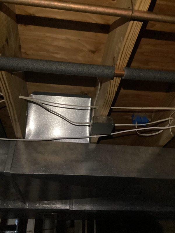 Completed complimentary electrical inspection of residential property. Examined unfinished basement/utility area with exposed electrical wiring, HVAC components, and plumbing infrastructure. Inspected main electrical panel, documenting circuit breaker configuration and labeling for safety compliance and load distribution assessment.