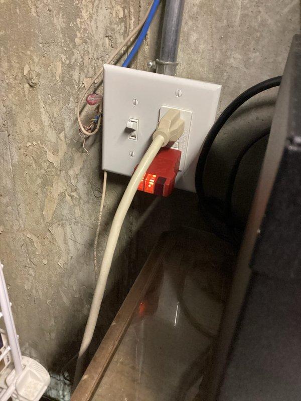 Conducted a comprehensive electrical inspection of the residential electrical system, focusing on GFCI outlet functionality in utility area and testing circuit integrity with an Amprobe device. Identified exposed wiring issues at a wall outlet installation and documented potential code violations where electrical connections were improperly secured.
