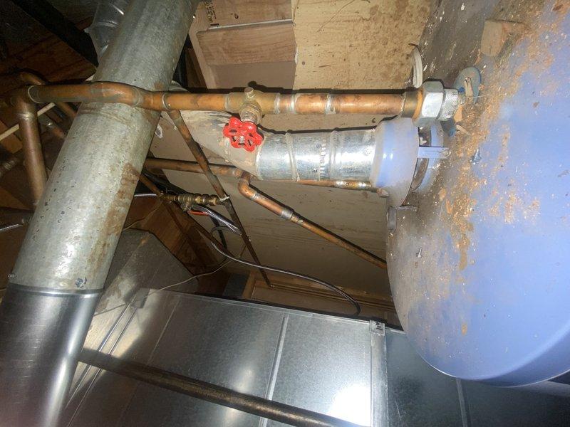 Successfully installed a 50-gallon gas tall water heater and completed gas line modifications to accommodate the unit. Removed existing copper gas piping in basement and installed new copper press gas components including tees, couplings, and valves according to code requirements. Routed approximately 10' of flexible gas piping to kitchen floor, which required drilling to widen subfloor hole for proper installation.