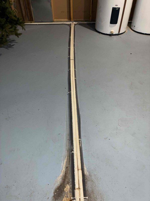 Responded to recall service for recently installed furnace system where inspector noted mold and clogged condensate lines. Inspected the PVC condensate drainage system in basement, identified accumulation of residue where pipes meet floor and along pipe runs. Replaced affected condensate tubes/pipes on all three HVAC systems as requested to resolve drainage issues and prevent future mold development.