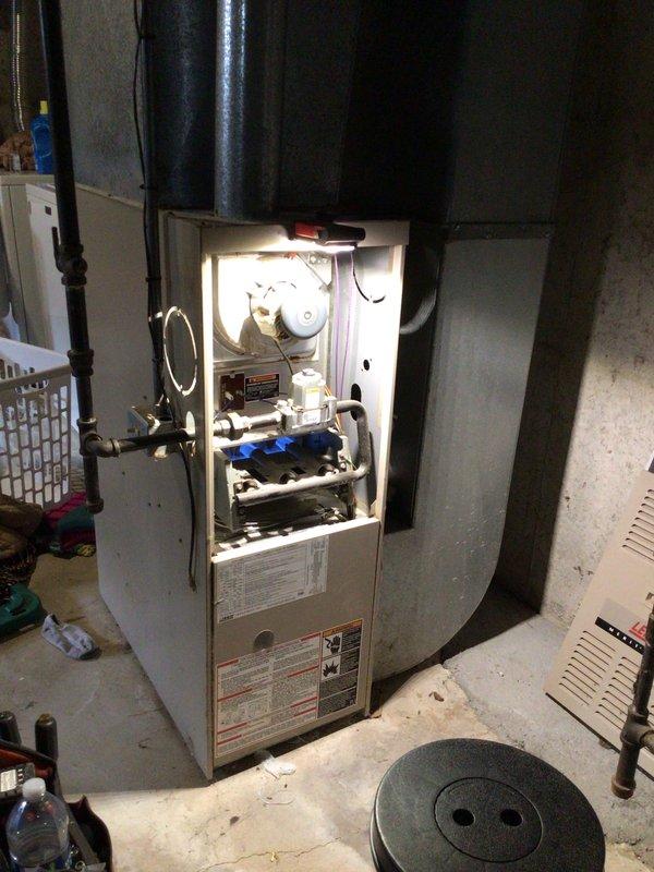 Performed comprehensive heating tune-up on 23-year-old furnace located in basement. Inspected and cleaned all internal components with front panel removed, and verified thermostat was functioning correctly with temperature reading at 73°F. No immediate issues requiring repair were identified during the preventative maintenance service.