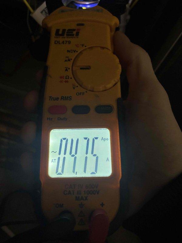 Performed routine cooling maintenance on a 2-year-old Lennox HVAC system. Inspected blower wheel assembly and measured electrical current draw (0.75A) with digital multimeter to verify proper motor operation. System was confirmed to be functioning properly with all parameters within normal operating ranges.