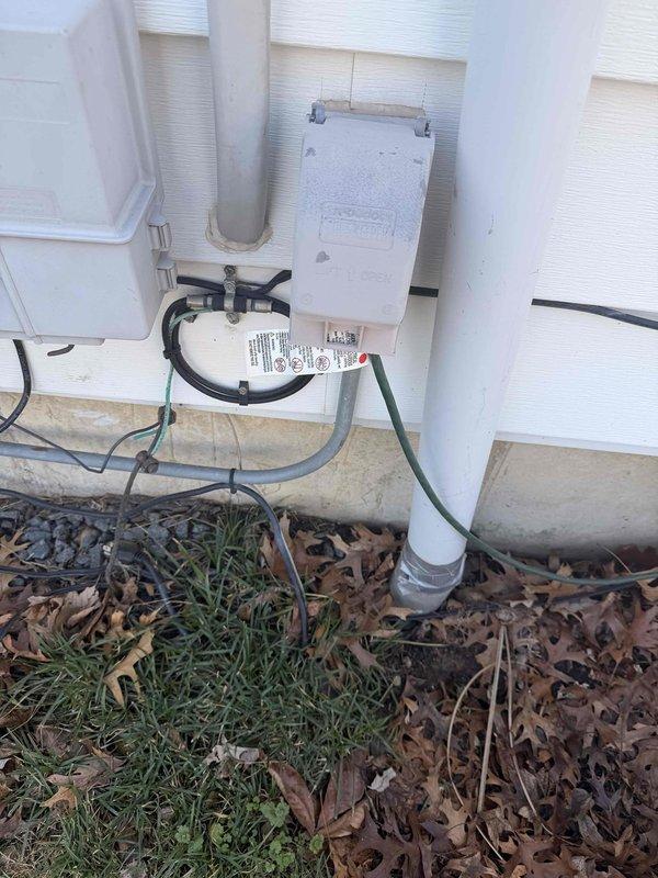 Performed a comprehensive free electrical inspection of the property, examining the exterior electrical connections and utility junction boxes with weatherproof covers and conduits. Inspected the GE circuit breaker panel containing a 200-amp main breaker and multiple subsidiary breakers of varying amperages, confirming proper wire connections and overall system condition.