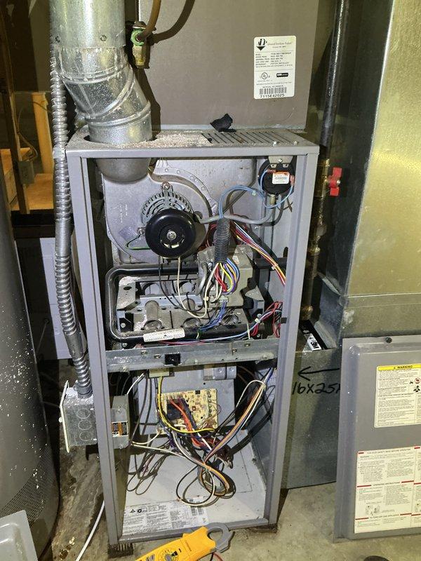 Performed comprehensive heating tune-up on 12-year-old furnace located in basement, including inspection of internal components, electrical connections, and control board. System was tested for proper operation with thermostat set at 75°F, and included service of the connected humidifier. All systems verified to be functioning correctly with no issues detected.