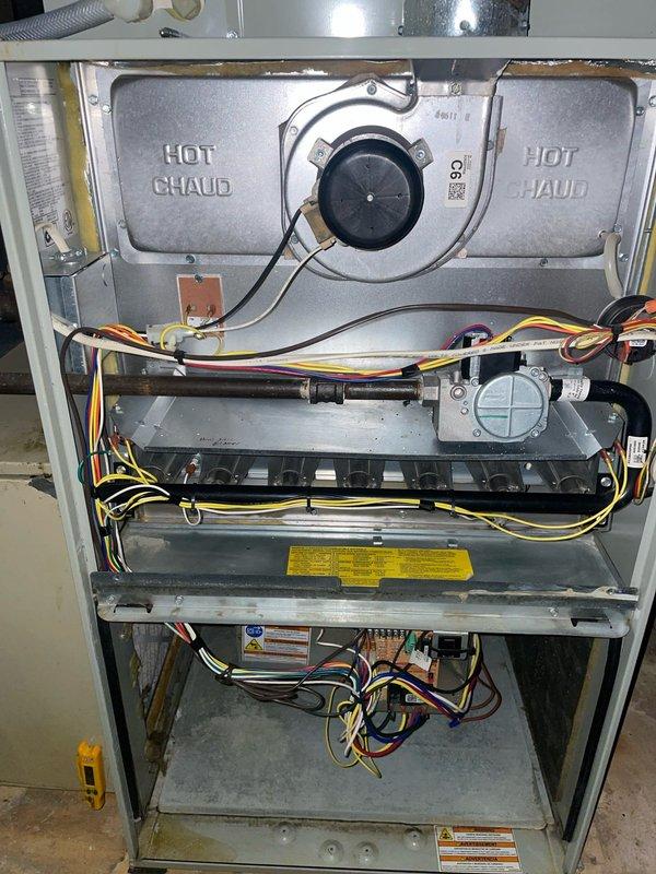 Performed cooling tune-up on 9-year-old AC system. Inspected and cleaned heavily soiled blower wheel assembly which had significant dust accumulation affecting performance. Serviced interior components of the furnace unit, checking electrical connections and control components for proper operation.
