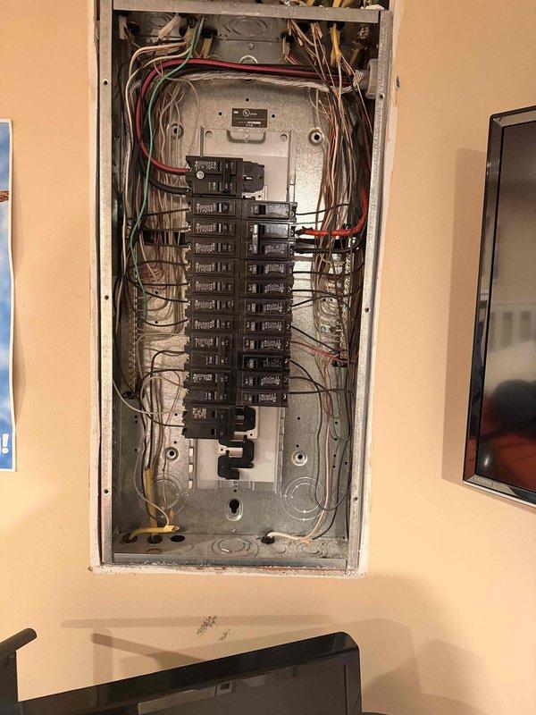 Performed comprehensive electrical panel inspection as part of promotional home audit service. Examined circuit breaker configuration and wiring connections in main panel, documenting the current installation with detailed photos. Observed standard double-column breaker arrangement with multiple wire types, noting overall condition of connections and organization for safety compliance.