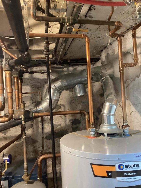Performed annual maintenance tune-up on 26-year-old Dunkirk boiler system. Inspected all copper piping infrastructure, brass fittings, and ventilation ducts for proper operation. System is functioning correctly with no issues identified; customer informed of completed service.