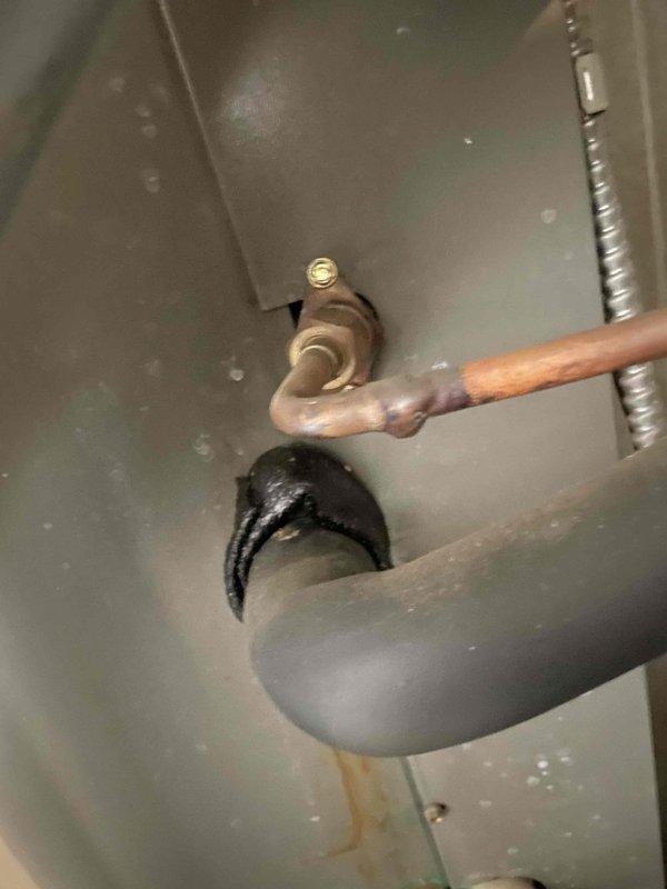 Performed bi-annual preventative maintenance on 20-year-old Lennox HVAC system, focusing on AC components. Identified signs of corrosion at copper pipe connection and possible moisture issues in the housing unit. Temperature readings with digital thermometer confirmed system is operating at 40.0°F, within acceptable parameters despite the unit's age.