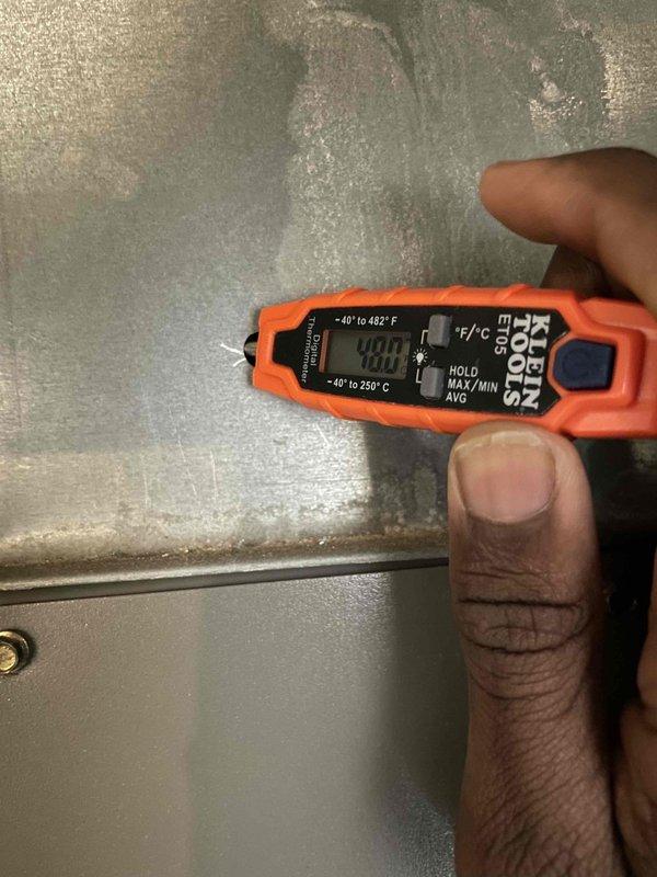 Performed bi-annual preventative maintenance on 20-year-old Lennox HVAC system, focusing on AC components. Identified signs of corrosion at copper pipe connection and possible moisture issues in the housing unit. Temperature readings with digital thermometer confirmed system is operating at 40.0°F, within acceptable parameters despite the unit's age.