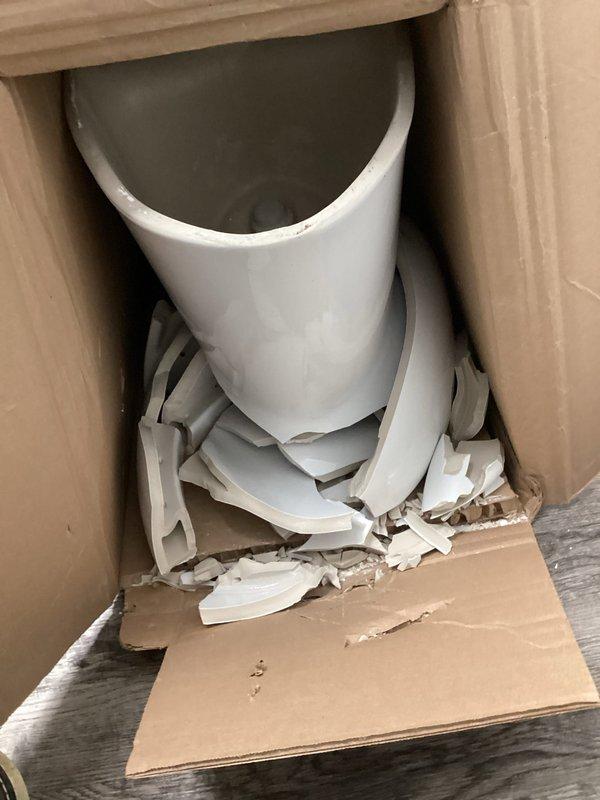 Installed new toilet in commercial bathroom with ADA-compliant grab bars. Noted damaged PVC components in packaging upon arrival which required replacement parts. Completed installation successfully and verified proper function before departure.