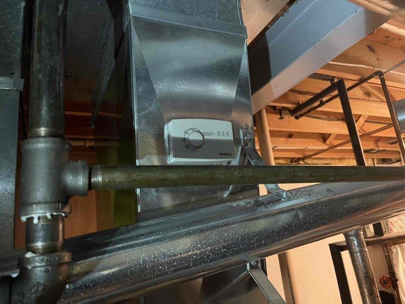 Successfully replaced two AprilAire 600M humidifiers on existing HVAC system. Installation included mounting new units, connecting required ductwork with six 6" elbows and four sections of 6" pipe, and performing sheet metal patch work as needed. Verified proper operation of both humidifiers and confirmed heating/cooling system functionality before completing service.