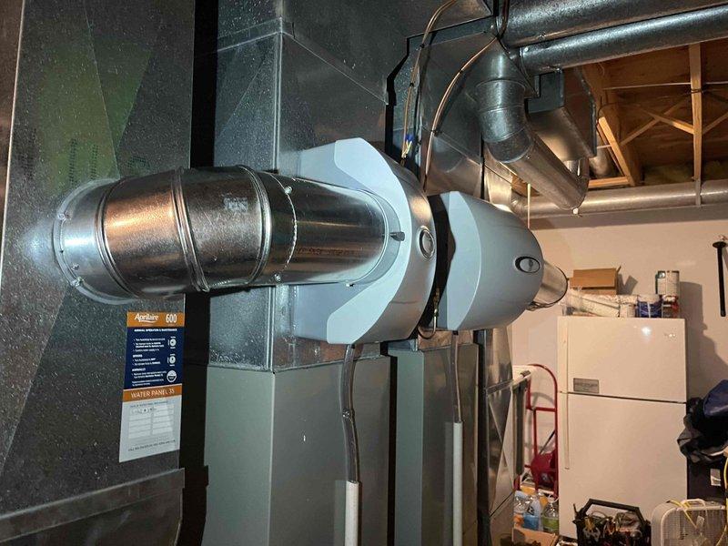 Successfully replaced two AprilAire 600M humidifiers on existing HVAC system. Installation included mounting new units, connecting required ductwork with six 6" elbows and four sections of 6" pipe, and performing sheet metal patch work as needed. Verified proper operation of both humidifiers and confirmed heating/cooling system functionality before completing service.