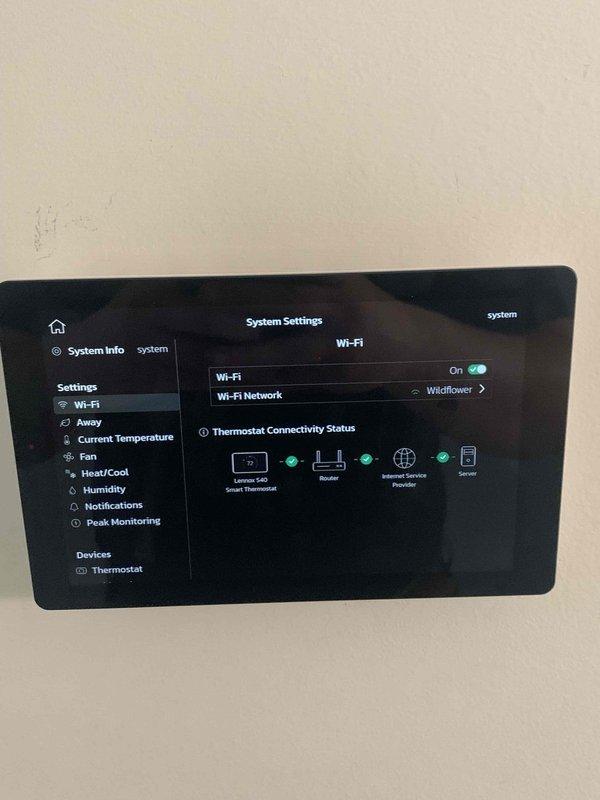Responded to service call for thermostat connectivity issue where system was unable to reconnect to network. Diagnosed and successfully reconnected Lennox S40 Smart Thermostat to customer's "Wildflower" Wi-Fi network, restoring full functionality including heat settings and remote access capabilities. System now operating normally with proper communication between thermostat, router, and connected devices.