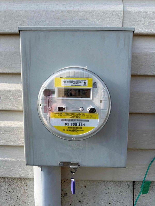 Completed free electrical inspection of property. Inspected main electrical service panel containing 27-circuit capacity with properly labeled breakers and main disconnect. Digital utility meter was examined and found to be in good working condition with no visible damage or safety concerns.