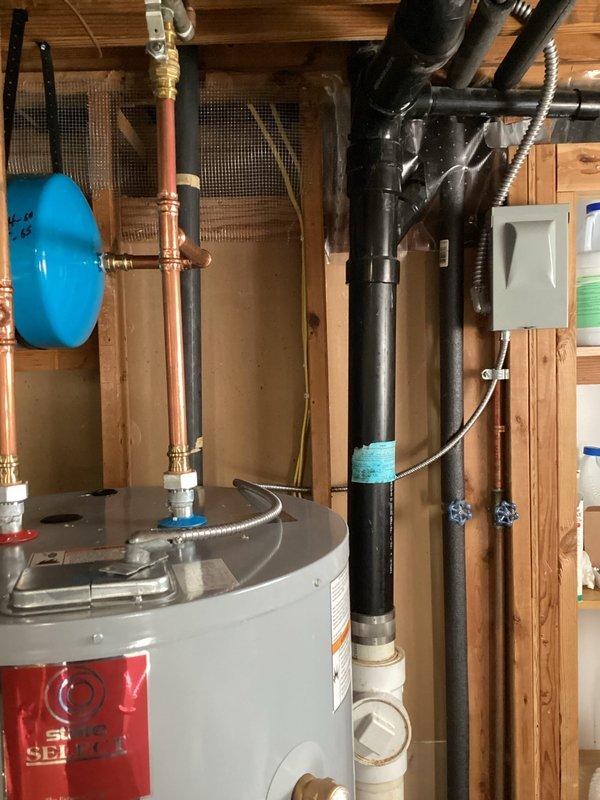 Completed electrical service work on water heater installation, including connecting the flexible metal conduit to the water heater access panel. Identified need for replacement wiring from disconnect to water heater, requiring 10/2 MC cable; scheduled return visit to complete this repair.