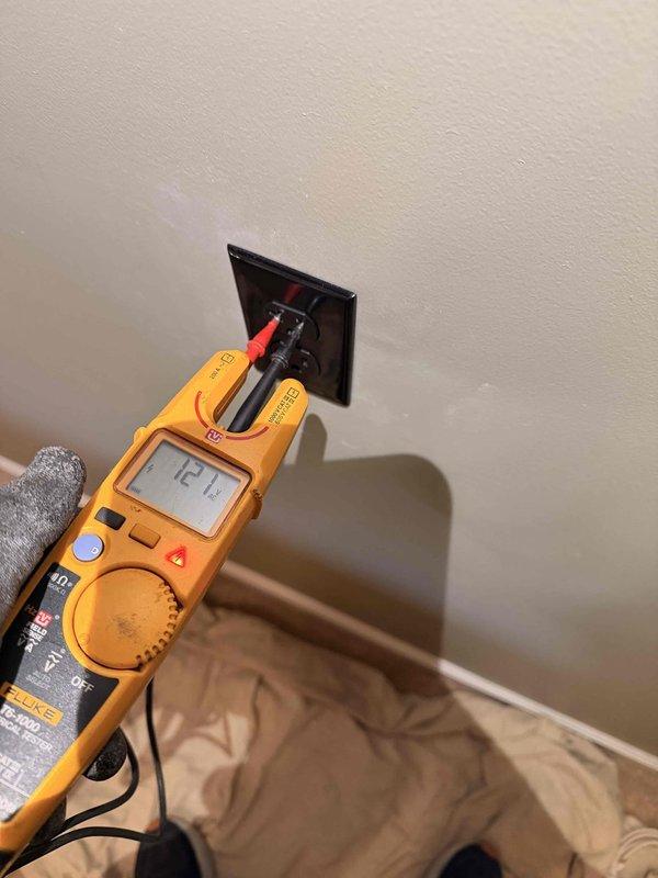 Completed circuit extension as per estimate. Installed new electrical outlets on interior wall with proper mounting bracket. Performed comprehensive voltage testing of all circuits, confirming proper operation at 121V with digital multimeter to ensure installation meets code requirements and safety standards.