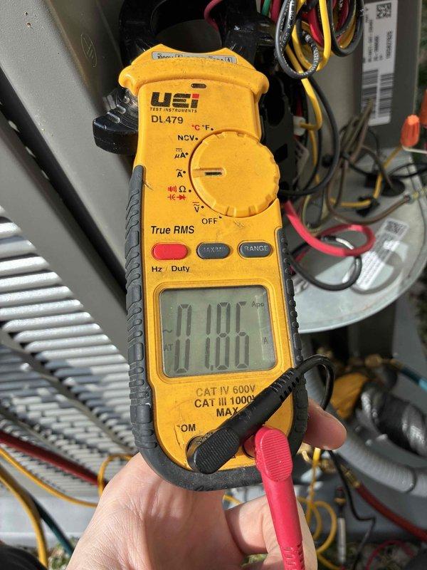 Responded to service call for 11-month old A/C unit making loud noise. Performed electrical diagnostic testing with UEi DL479 clamp meter, measuring amperage (0.186) and voltage (17.0) to identify potential electrical issues. Unit is now operating within normal parameters.