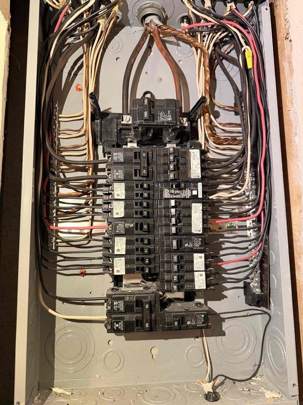 Conducted a comprehensive electrical inspection of the main distribution panel. Examined the circuit breaker configuration and verified appropriate wire routing throughout the panel. All breakers were properly labeled and the wiring appeared professionally installed with no immediate safety concerns identified.