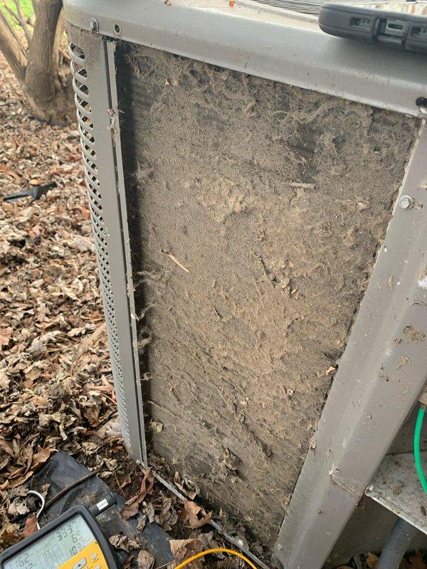 Diagnosed 6-year-old outdoor unit that was short-cycling with buzzing noise. Inspection revealed severely clogged condenser coil with extensive dirt/debris accumulation, significantly impairing airflow and system efficiency. Performed thorough cleaning of condenser coil and verified proper operation after service.