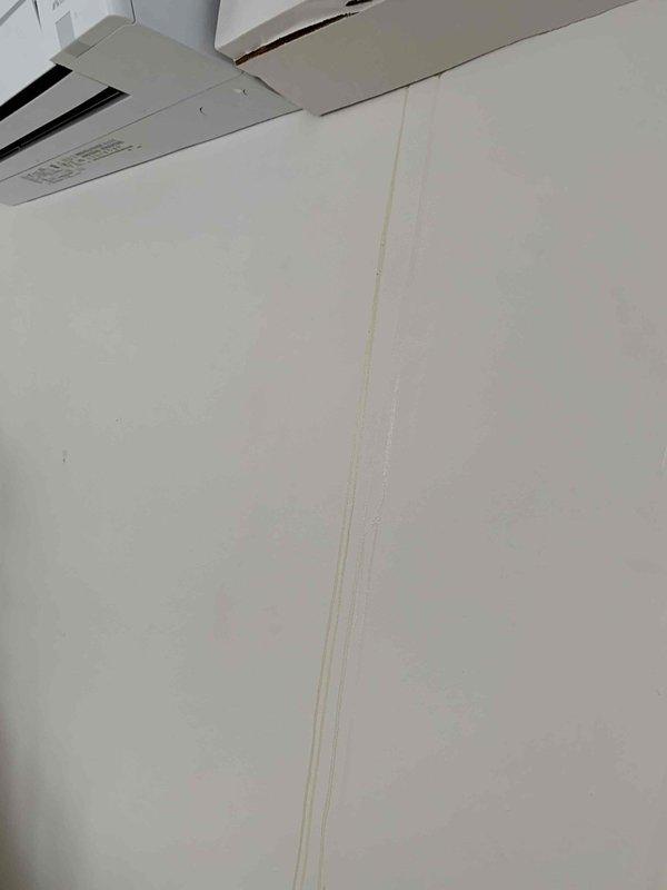 Responded to service call for a 2-month-old mini split system leaking water onto floor and walls. Inspected condensate drainage system and found improper installation of drain lines causing water to back up. Repositioned and secured condensate drain line to ensure proper flow, eliminating the leak issue.