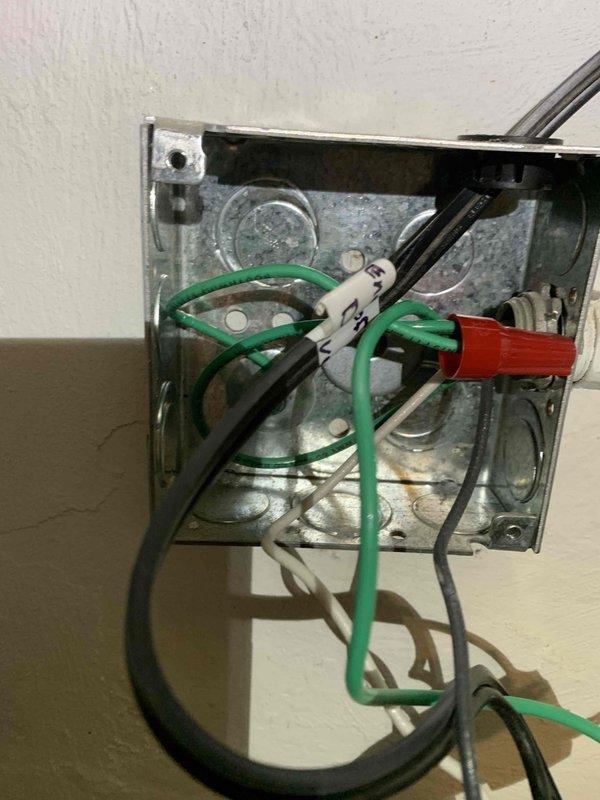 Returned to repair damaged light post as previously scheduled. Inspected electrical junction box and found exposed wiring requiring attention. Rewired connections using proper wire nuts and ensured ground, neutral, and hot wires were correctly terminated. Completed installation and verified proper operation of light fixture.