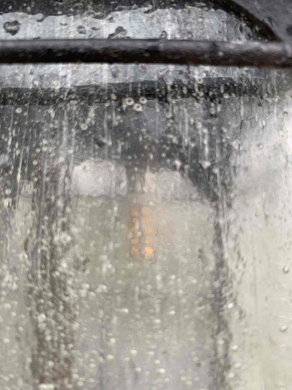 Returned to repair damaged light post as previously scheduled. Inspected electrical junction box and found exposed wiring requiring attention. Rewired connections using proper wire nuts and ensured ground, neutral, and hot wires were correctly terminated. Completed installation and verified proper operation of light fixture.