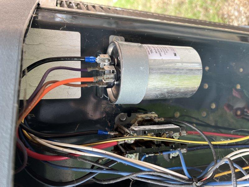 Responded to no-cooling complaint on 10+ year old residential AC unit. Diagnostic inspection revealed severely corroded and burnt terminals on the motor run capacitor. Replaced failed capacitor, restoring proper system operation and cooling function.