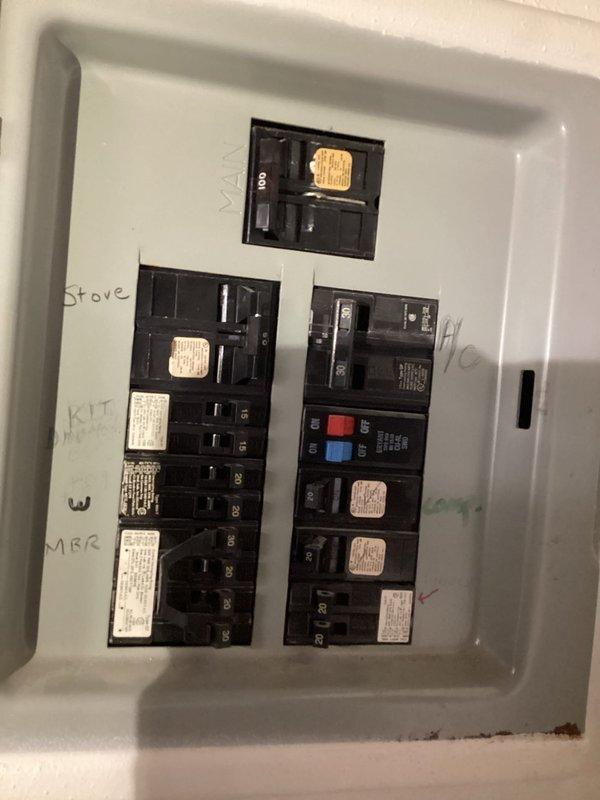 Performed complimentary electrical inspection of residence. Tested outlet functionality with circuit analyzer, confirming proper voltage and ground connection. Examined main electrical panel, noting multiple circuits with handwritten labels; observed standard breakers and specialized GFCI protection for critical areas including stove circuit. No immediate safety hazards identified.