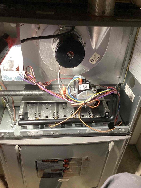 Responded to service call for 6-year-old furnace blowing cold air with thermostat error messages. Performed electrical diagnostics using True RMS multimeter, measuring amperage draw on blower motor (10.2A). Inspected internal wiring connections and components, which appeared properly connected with no visible damage or anomalies. Restored proper heating operation and cleared thermostat error codes.