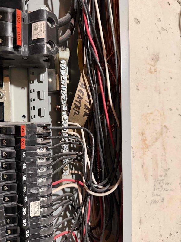 Completed complimentary electrical inspection of residential circuit breaker panel. Documented and assessed main panel configuration including multiple circuit breakers (15A, 20A, 30A ratings), wiring condition, and load distribution. Panel exhibited dense but organized wiring with proper color coding (black, red, white) though some crowding was observed.