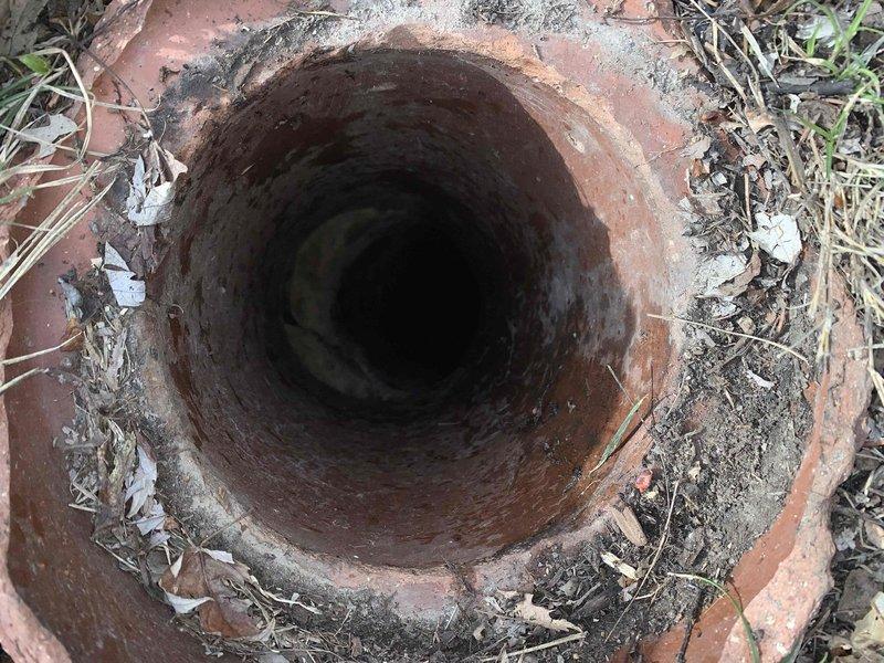 Responded to service call for main drain cleanout in basement. Upon inspection, found terracotta drain pipe with accumulated debris including soil, leaves, and organic matter both around and inside the pipe opening. Cleaned out all debris from the drain line to restore proper drainage function and prevent potential backups.