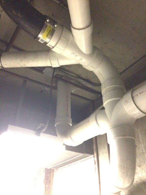 Successfully completed cast iron stack replacement with new PVC drain system in commercial property. Installed multiple branch connections with proper fittings and verified adequate slope for proper drainage. All valves and connections were tested and confirmed to be functioning properly with no leaks observed.