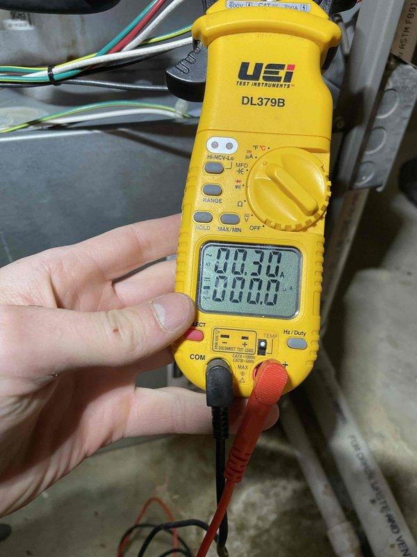 Arrived to replace failed inducer motor as per previous diagnosis. Performed electrical testing with UEI DL379B multimeter to verify proper voltage before installation. Successfully installed new inducer motor (part #81W45), connected all necessary wiring and tubing, and confirmed proper system operation in both heating and cooling modes. Old component was removed for disposal.