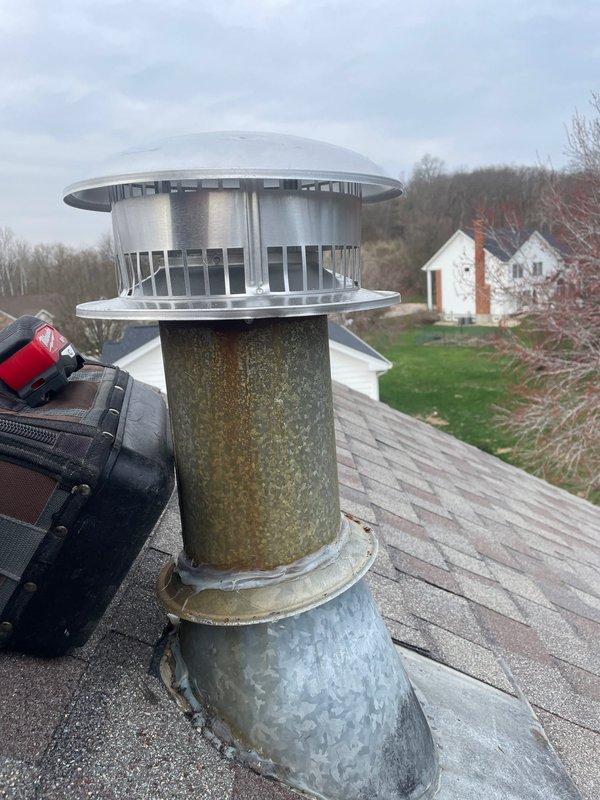 Successfully installed a 6" class B flue cap on the weathered chimney system as scheduled. Removed and properly disposed of the previous cap which showed significant corrosion and rust damage. New installation provides proper ventilation while preventing water intrusion and debris entry.