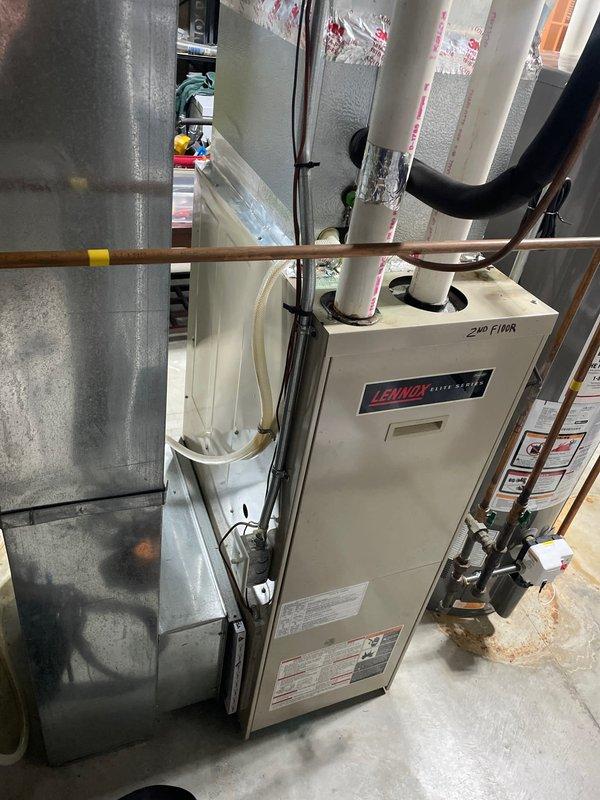 Diagnosed 2-year-old residential AC system with no cooling issue; discovered evaporator coil leaking requiring replacement and noted potential blower motor failure. System inspection revealed newer condensers with significantly older internal components, requiring further evaluation for comprehensive repair solution.