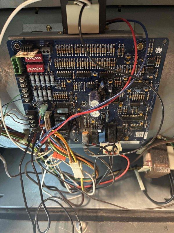 Responded to service call for furnace non-operation with error code. Performed electrical diagnostics using multimeter, measuring voltage at control board (reading 0.6). Inspected circuit board connections and DIP switch settings, identifying faulty control board as source of system failure.