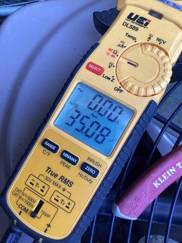 Performed comprehensive cooling system tune-up on four AC units, including cleaning heavily soiled electronic air filters that showed significant dust and debris accumulation. Diagnostic testing with UEi DL589 multimeter confirmed proper system operation with temperature readings at 70.0°F and 35.03°F, indicating appropriate temperature differential across the evaporator coil.
