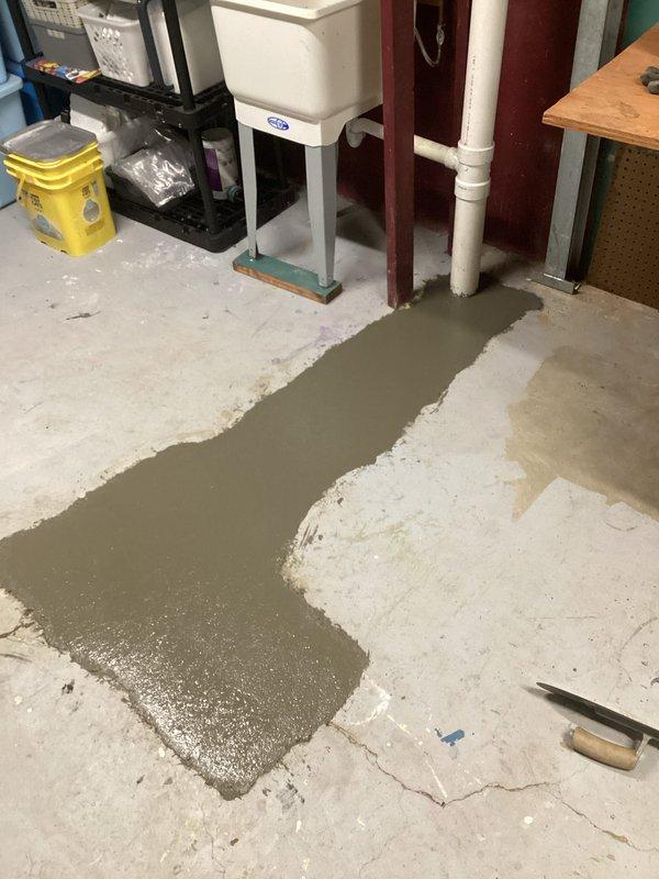 Excavated a 2'x3'x2' trench to access sewer line in basement floor, installed new PVC sewer pipe with clean-out access point, and completed the job by pouring fresh concrete to restore the floor surface.
