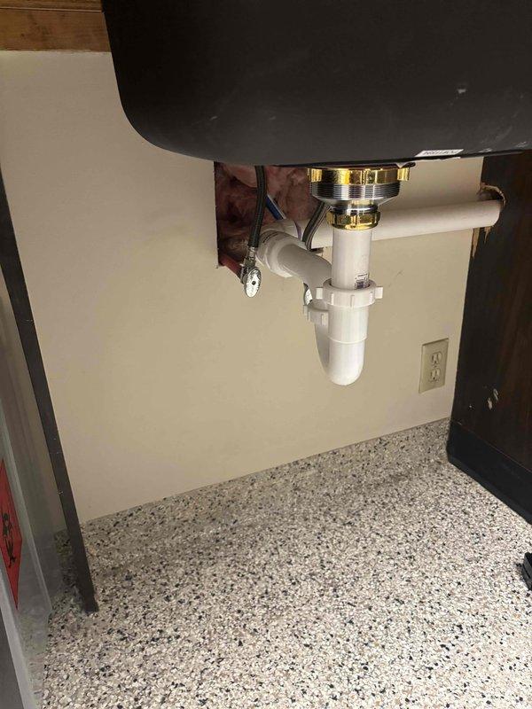 Responded to call back on recent water heater installation that was not heating properly. Upon inspection, determined that the previously recommended electrical wire replacement was insufficient to resolve the issue. Performed complete diagnostic of unit connections and components, documenting condition with photographs of heating element assembly and adjacent plumbing fixtures.