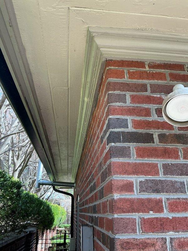 Conducted a generator estimate at residential property, examining potential installation location adjacent to existing HVAC units on gravel base against brick exterior. Photographed site conditions including proximity to building corner and current electrical service to determine appropriate generator specifications and installation requirements.