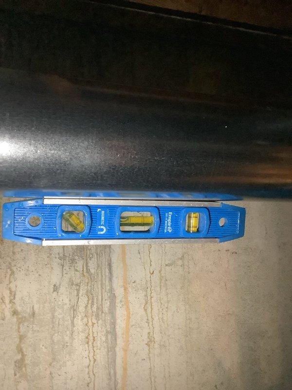 Completed installation of a 50-gallon tall gas water heater with 3/4" pressure reducing valve. Installed proper water supply connections and verified level placement of unit. Work performed under permit #26PLU-04811 with ID sticker JP000097 (Bret Lux).