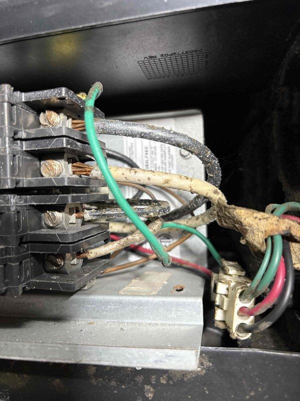 Diagnosed no heat issue in Unit 10 basement system. Inspection revealed electrical connection issues with degraded wiring insulation and accumulated dust/grime at junction box. Serviced control board connections and secured loose wiring with proper fasteners to restore heating function.