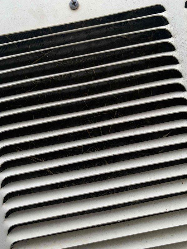 Responded to service call for AC unit not cooling properly. Inspection revealed significant dust accumulation in the ventilation system and exterior deterioration of the condenser unit casing, with visible peeling and separation of the outer layer. Cleaned ventilation system and recommended replacement of damaged exterior panels to prevent further system degradation.