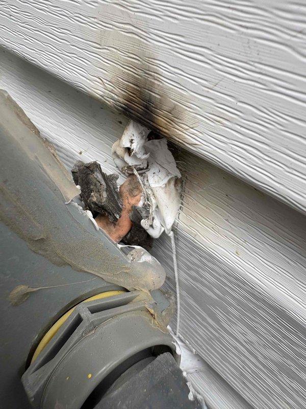 Responded to unit not cooling with 434 error message. Inspection revealed damage to exterior siding where electrical wiring was exposed and burned, likely caused by siding installation crew. Repaired damaged wiring connection to restore system operation.