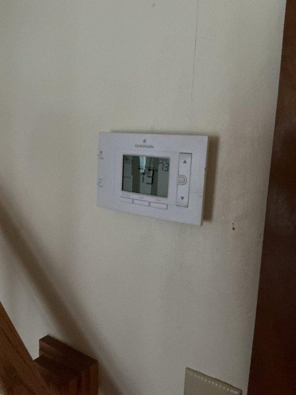 Performed comprehensive heating tune-up on 9-year-old basement furnace, including inspection of electrical components, wiring connections, and control boards. Checked and verified proper operation of Emerson thermostat (currently reading 73°F) and confirmed system cycling. Filter was inspected and appears to be in good condition with minimal buildup.