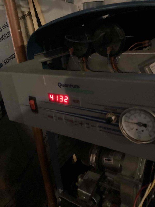 Responded to no-heat call for 16-year-old Dunkirk 95M200 boiler displaying error code E04 (previously E02). Diagnosed system failure affecting both space heating and domestic hot water supply via auxiliary tank. Inspected Quantum control panel and pressure readings, performed necessary repairs to restore proper boiler operation and hot water service.