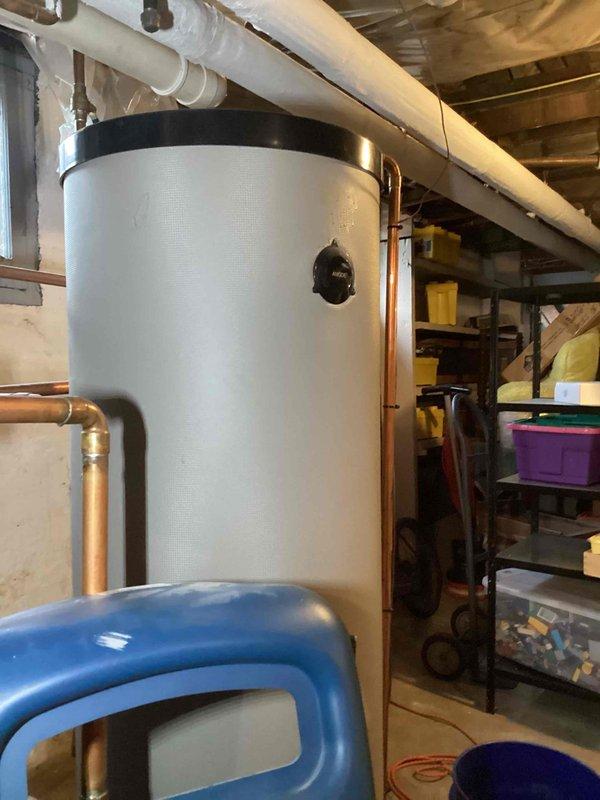 Responded to no-heat call for 16-year-old Dunkirk 95M200 boiler displaying error code E04 (previously E02). Diagnosed system failure affecting both space heating and domestic hot water supply via auxiliary tank. Inspected Quantum control panel and pressure readings, performed necessary repairs to restore proper boiler operation and hot water service.