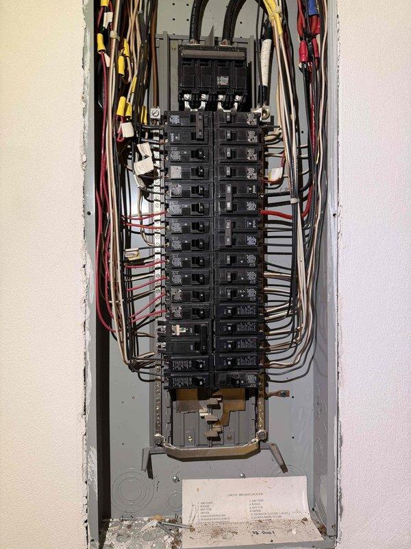 Completed comprehensive electrical home audit, including thorough inspection of main electrical panel containing approximately 20-24 circuit breakers with organized wire bundles. Examined panel directory and wiring connections for safety compliance, documented existing electrical infrastructure with detailed photographs for reference, and verified proper circuit labeling to ensure household electrical system meets current safety standards.