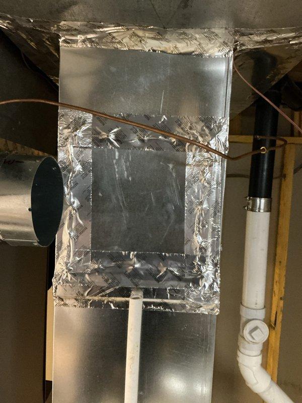 Successfully installed a Humid-Aire humidifier system in the utility space, connecting it to the existing HVAC ductwork using 6-inch round pipe and elbows. Completed all necessary connections including water supply line and low voltage wiring, with all joints properly sealed using foil tape for optimal system performance.